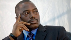 President Kabila looks on during signature ceremonies.