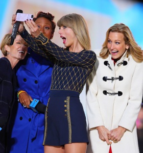 Taylor Swift takes a selfie on stage with 'Good Morning America' hosts Robin Roberts, Ginger Zee, Lara Spencer in Times Square, NYC