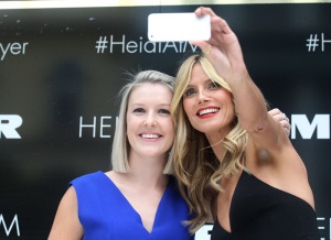 Heidi Klum launches her new lingerie line, The Heidi Klum Intimates collection, at Myer in Melbourne's CBD Heidi Klum arrived on a Melbourne Tram, posing on the steps of the tram with models wearing the Heidi Klum Intimates Collection. Heidi then joined Kris Smith on stage where she kissed him several times leaving lipstick marks on his face, before joining fans for some selfies. Kris also showed Heidi his under, as he was wearing the her mens underwear range. Heidi also watched a fashion parade of her lingerie line. Pictured: Heidi Klum Ref: SPL936819  270115   Picture by: Splash News Splash News and Pictures Los Angeles:310-821-2666 New York:212-619-2666 London:870-934-2666 photodesk@splashnews.com 