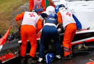 SUZUKA, JAPAN - OCTOBER 05:  Jules Bianchi of France and Marussia receives urgent medical treatment after crashing during the Japanese Formula One Grand Prix at Suzuka Circuit on October 5, 2014 in Suzuka, Japan.  (Photo by Getty Images/Getty Images)