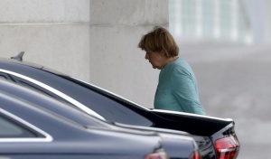 German Chancellor Angela Merkel arrives at the Chancellery in Berlin, Germany, July 6, 2015. France and Germany called for an emergency summit of euro zone leaders to discuss Greece's stunning referendum vote on Sunday to reject bailout terms, as calls mounted in Berlin to cut Athens loose from Europe's common currency.  REUTERS/Fabrizio Bensch