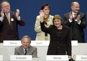 The picture dated 10 April 2000 shows CDU secretary general Angela Merkel waving after her speech at the federal party convent in Essen, Germany. Next to her the resigning then-Chairman of the Conservatives Wolfgang Schaeuble is pictured. For the first time ever Germany gets with Angela Merkel a female Chancellor. As being the yet youngest Head of Government she will lead the second big coalition in German history. Three weeks after the federal election, SPD and Union (i.e. CDU and CSU) agreed in the Chancellor question and at the distribution of the Ministries. Head of the Social Conservatives (CSU) Stoiber confirmed such according to dpa informations on Monday 10 October 2005.  EPA/MARTIN GERTEN