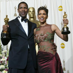 402719 228: Best Actor and Actress winners Halle Berry and Denzel Washington pose with their Oscars backstage during the 74th Annual Academy Awards March 24, 2002 at The Kodak Theater in Hollywood, CA. Washington won for his role in "Training Day" and Berry, the first African-American woman to ever win an Oscar for a leading role, won for "Monster's Ball". (Photo by Frederick M. Brown/Getty Images)