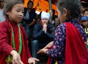 Prince Harry attends a welcome ceremony and is presented with a Feta Head dress at the home stay where he will spend the night, in Leorani hamlet in the foothills of the Himalayas, Nepal, on the 21st March 2016. Pictured: Prince Harry Ref: SPL1250295  210316   Picture by: James Whatling Splash News and Pictures Los Angeles:	310-821-2666 New York:	212-619-2666 London:	870-934-2666 photodesk@splashnews.com 