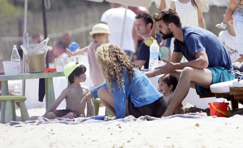 EXCLUSIVE: *PREMIUM EXCLUSIVE RATES APPLY*Shakira and her footballer husband Gerard Pique were spotted on the beach in Ibiza, along with their sons Milan and Sacha, on May 25th. The Colombian singer showed off her amazing bikini body and toned abs as she hit the water for a dip. Despite appearing to try to hide her famous derriere, she gave tantalizing glimpses with a see-through cover-up as she helped her kids play in the sand and then full-view as she changed into shorts. She looked in great shape and appeared to be having a great family holiday, kissing the Barcelona player a few times and with the whole family huddling up for a hug in the water. Pictured: Shakira,Gerard Pique Ref: SPL1294550 030616 EXCLUSIVE Picture by: Splash News Splash News and Pictures Los Angeles:310-821-2666 New York:212-619-2666 London:870-934-2666 photodesk@splashnews.com 