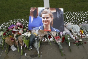 Tributes and candles left for murdered Labour Member of Parliament Jo Cox are seen in Parliament Square, London, Britain June 17, 2016 REUTERS/Stefan Wermuth