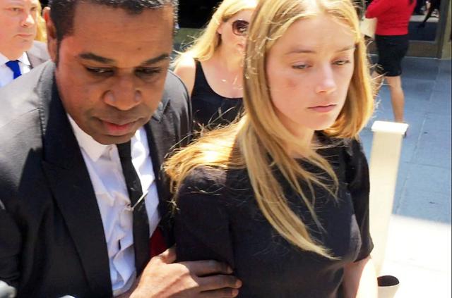 Actress Amber Heard leaves the Superior Court of Los Angeles in Los Angeles, California, U.S. May 27, 2016, with what appears to be a bruise on her right cheek after obtaining a restraining order against husband Johnny Depp in this still image from video. REUTERS/Rollo Ross TPX IMAGES OF THE DAY