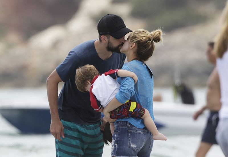 EXCLUSIVE: *PREMIUM EXCLUSIVE RATES APPLY*Shakira and her footballer husband Gerard Pique were spotted on the beach in Ibiza, along with their sons Milan and Sacha, on May 25th. The Colombian singer showed off her amazing bikini body and toned abs as she hit the water for a dip. Despite appearing to try to hide her famous derriere, she gave tantalizing glimpses with a see-through cover-up as she helped her kids play in the sand and then full-view as she changed into shorts. She looked in great shape and appeared to be having a great family holiday, kissing the Barcelona player a few times and with the whole family huddling up for a hug in the water. Pictured: Shakira,Gerard Pique Ref: SPL1294550 030616 EXCLUSIVE Picture by: Splash News Splash News and Pictures Los Angeles:310-821-2666 New York:212-619-2666 London:870-934-2666 photodesk@splashnews.com 