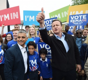 epa05337407 British Prime Minister David Cameron (R) and Mayor of London Sadiq Khan (L) greet supporters during the launch of the battle bus for the 'Remain In' campaign at Froebel College of the University of Roehampton in London, Britain, 30 May 2016. Khan and Cameron will continue to campaign around the United Kingdom in the lead up to the EU referendum on 23 June. EPA/FACUNDO ARRIZABALAGA / POOL