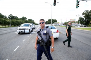 Police officers block off a road after a shooting of police in Baton Rouge, Louisiana, U.S. July 17, 2016. REUTERS/Joe Penney