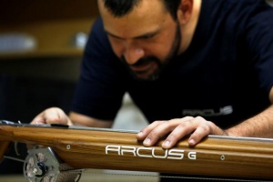 Manufacturer of the Arcus wooden spearguns Hatzirodos checks a speargun at his workshop in Gerakas, near Athens
