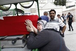 epa05428932 People attend a funeral of Omer Can Katar who was killed in a coup attempt on 16 july, at Fatih Mosque, in Istanbul, Turkey, 17 July 2016. Turkish Prime Minister Yildirim reportedly said that the Turkish military was involved in an attempted coup d'etat. Turkish President Recep Tayyip Erdogan has denounced the coup attempt as an 'act of treason' and insisted his government remains in charge. Some 104 coup plotters were killed, 90 people - 41 of them police and 47 are civilians - 'fell martrys', after an attempt to bring down the Turkish government, the acting army chief General Umit Dundar said in a televised appearance. EPA/SEDAT SUNA