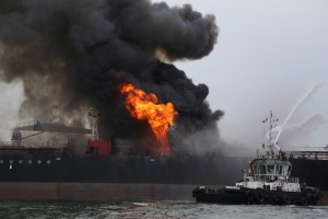 Firefighting boats works to extinguish a fire aboard the tanker Burgos about seven nautical miles off the coast of the port city of Boca del Rio, Mexico, Saturday, Sept. 24, 2016. The tanker was carrying about 168,000 barrels of gasoline and diesel fuel. Mexico's Navy rescued 31 crew members and no injuries were reported. There were no immediate reports of fuel spills and the cause of the fire was unknown. (AP Photo/Ilse Huesca)