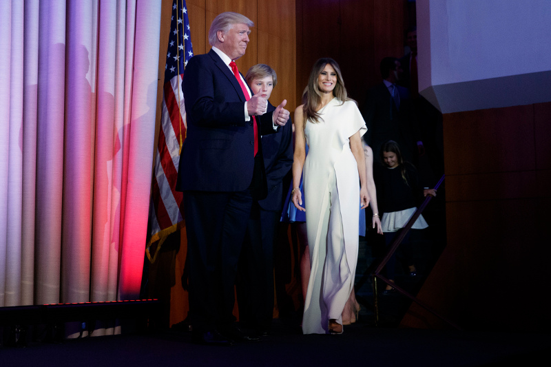 President-elect Donald Trump gives a thumbs up as he arrives to speak to an election night rally, Wednesday, Nov. 9, 2016, in New York. From left, Trump, his son Barron Trump, and wife Melania Trump. (AP Photo/ Evan Vucci)