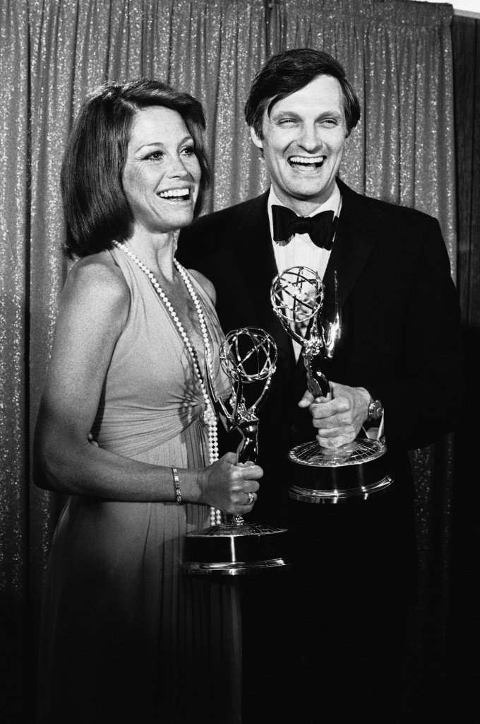 Mary Tyler Moore and Alan Alda, the brass-taunting Army surgeon of M*A*S*h* smile as they pose with the Emmys they won in Los Angeles as best actress and actor of a series, May 28, 1974. (AP Photo/David F. Smith)