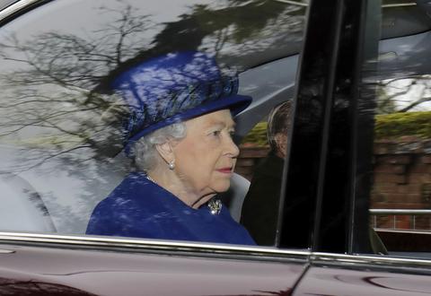 Britain's Queen Elizabeth II in a car with Prince Philip, arrives to attend the morning church service at St Mary Magdalene Church in Sandringham, England, Sunday Jan. 8, 2017.  The 90-year-old British monarch was applauded by well-wishers as she arrived by car at St. Mary Magdalene Church in eastern England. It was her first public appearance in several weeks. (Chris Radburn/PA via AP)