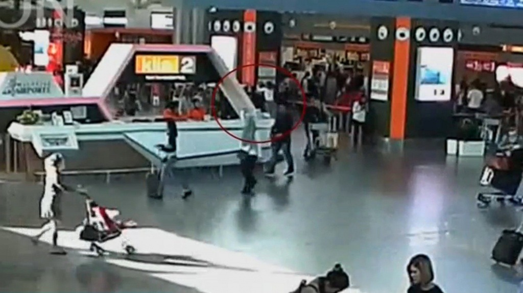 Video grab appears to show a man purported to be Kim Jong Nam being accosted by a woman in a white shirt at Kuala Lumpur International Airport in Malaysia