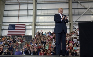 President Donald Trump waits to speak at his "Make America Great Again Rally" at Orlando-Melbourne International Airport in Melbourne, Fla., Saturday, Feb. 18, 2017. Trump is launching his 2020 reelection campaign just 1,354 days before the 2020 election. (AP Photo/Susan Walsh)