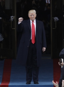 President-elect Donald Trump pumps his fist as he arrives for his Presidential Inauguration at the U.S. Capitol in Washington, Friday, Jan. 20, 2017. (AP Photo/Patrick Semansky)