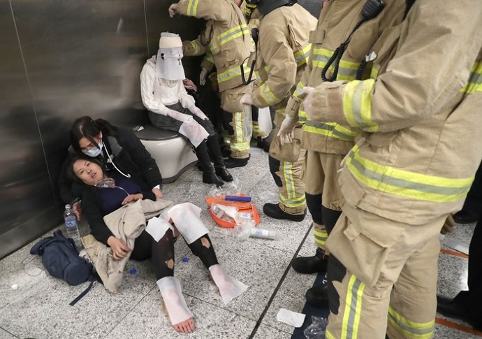A commuter receives first aid treatment