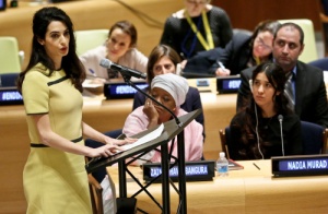 Human rights lawyer Amal Clooney, left, address a United Nations human rights meeting called “The Fight against Impunity for Atrocities: Bringing Da’esh [ISIS] to Justice," Thursday, March 9, 2017 at U.N. headquarters. (AP Photo/Bebeto Matthews)
