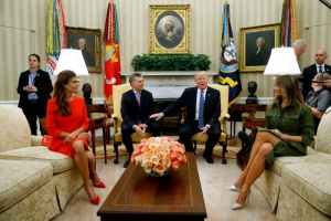 President Donald Trump and first lady Melania Trump, right, meet with Argentine President Mauricio Macri and first lady Juliana Awada in the Oval Office of the White House, Thursday, April 27, 2017, in Washington. (AP Photo/Evan Vucci)